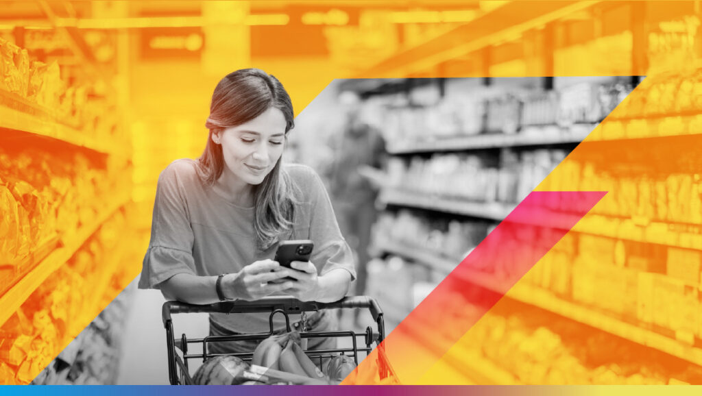 Woman looking at smartphone while shopping