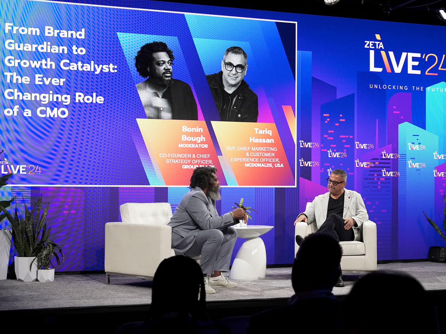 Bonin Bough and Tariq Hassan speaking at Zeta Live 2024 during their panel, 'From Brand Guardian to Growth Catalyst,' discussing the evolving role of CMOs