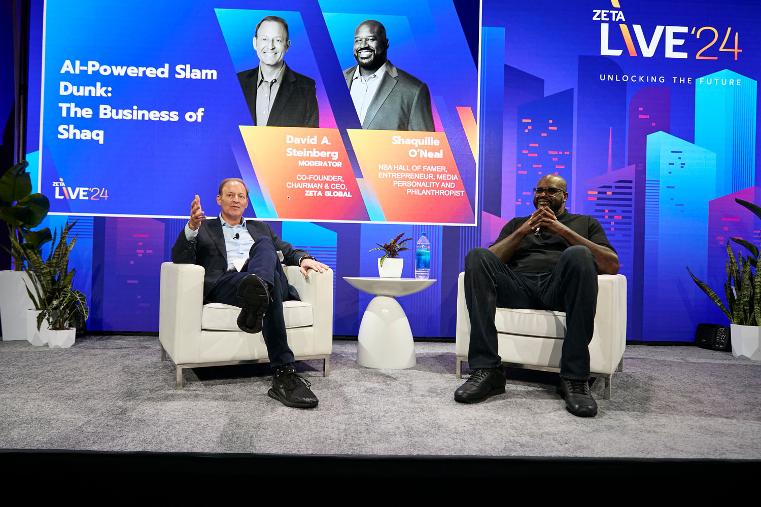 David A. Steinberg and Shaquille O'Neal share a laugh during their keynote at Zeta Live 2024, highlighting the intersection of AI, branding, and entrepreneurship with personal stories and humor.