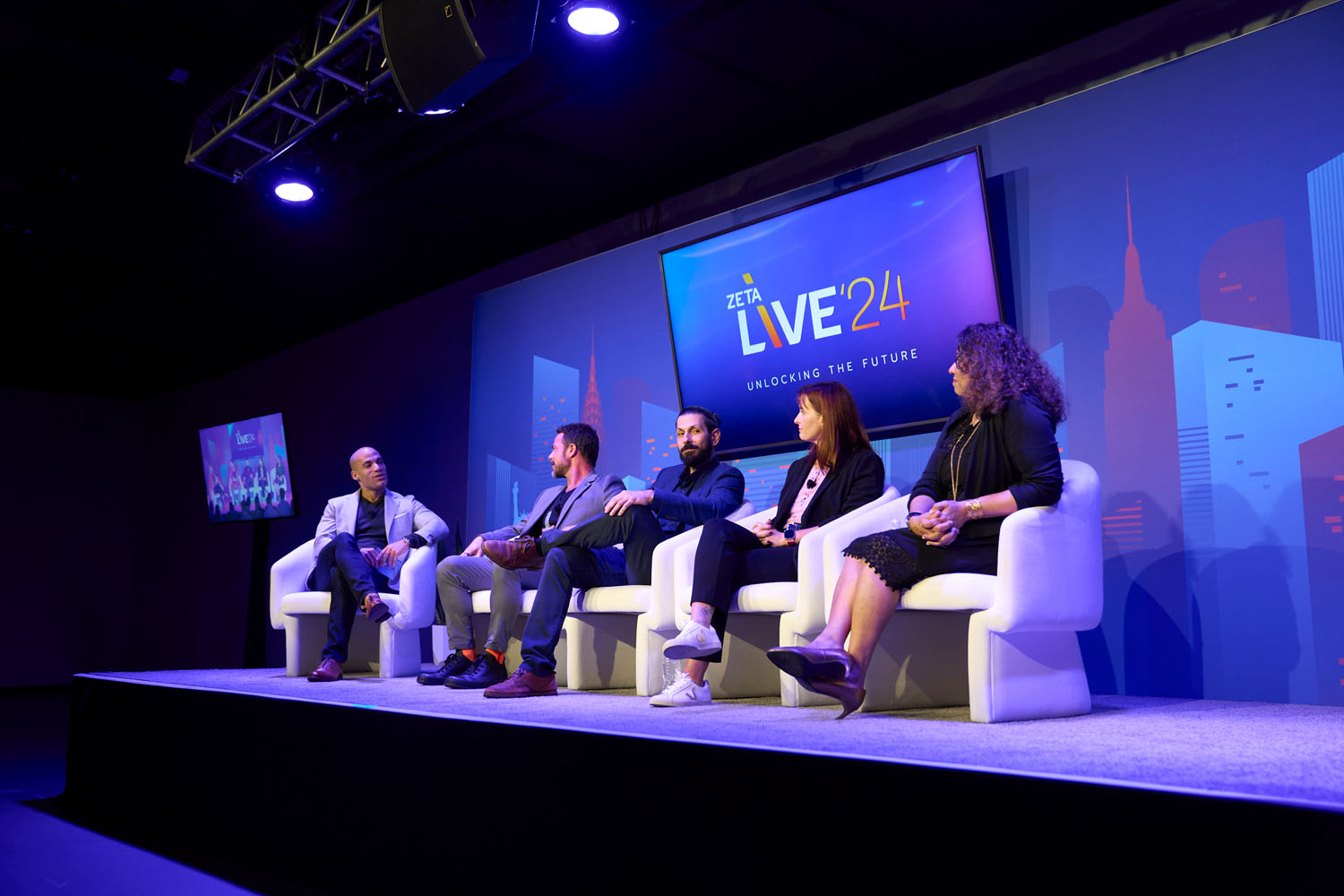 Harrison Davies, Matt Keiser, Bashir Egbahli, Dezeree Christman, and Ritu Trivedi speaking at Zeta Live 2024 on AI in business.