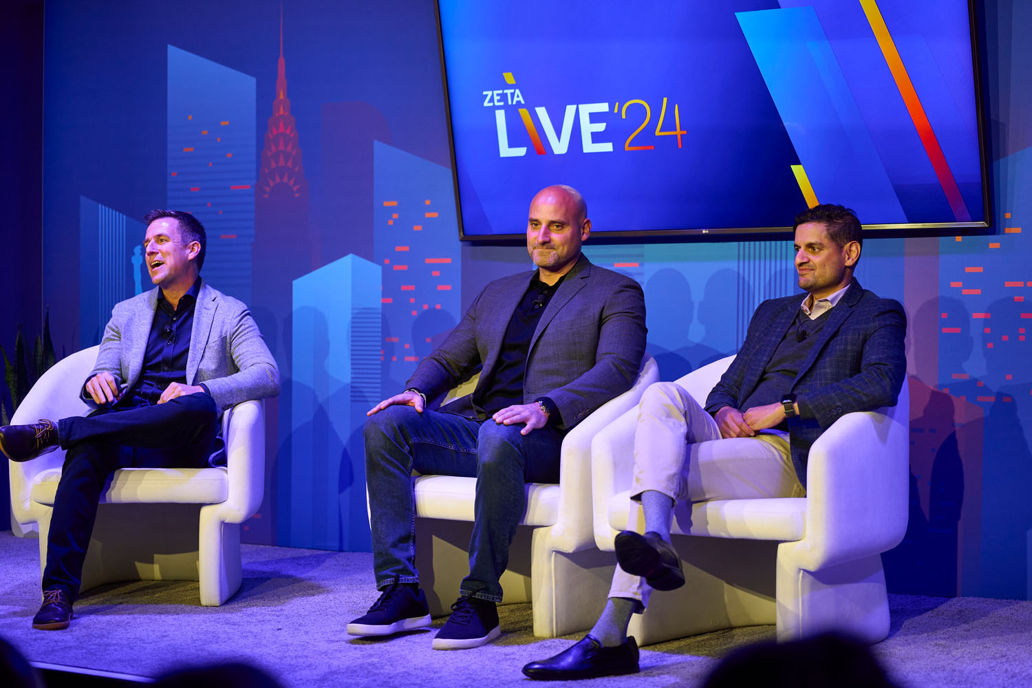 Mark Abraham, Chris Monberg, and Neej Gore at Zeta Live 2024 discussing innovation in business